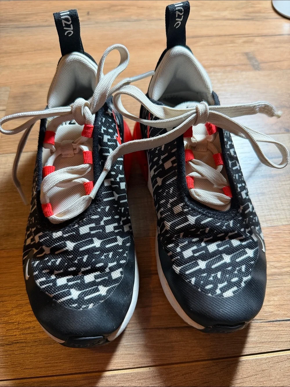 Nike Black and White Patterned Sneakers with Red Eyelet Accents